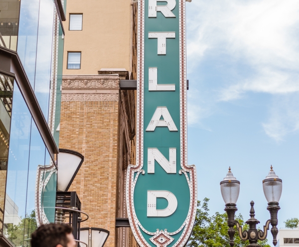 A vertical Portland sign on the exterior of the Arlene Schnitzer Concert Hall.