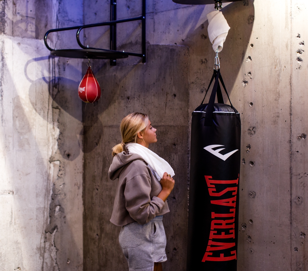 A woman at a punching bag in the gym at the Heathman Hotel in Portland, Oregon.